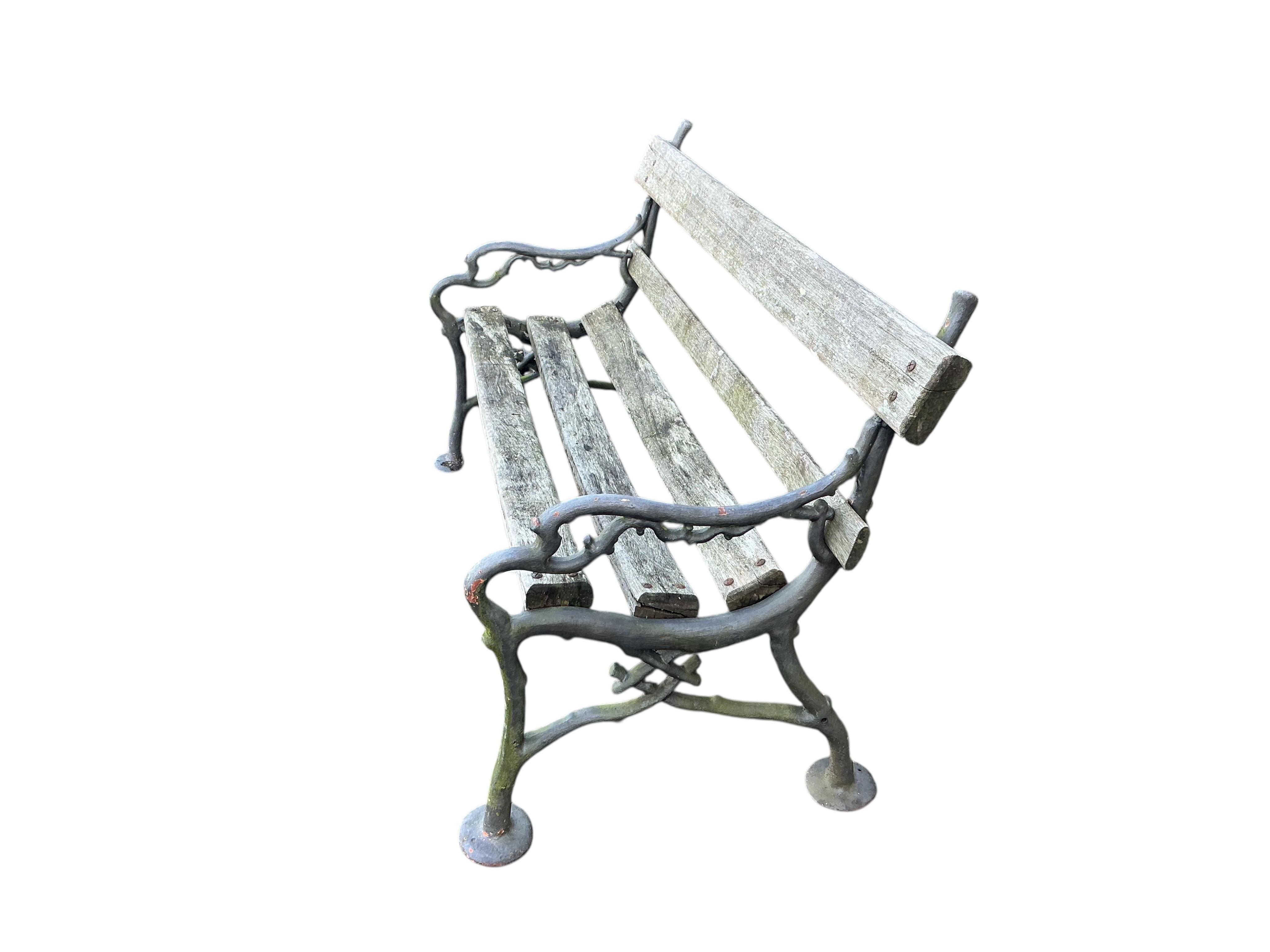 A Coalbrookdale style slatted cast iron garden bench, width 152cm, depth 66cm, height 82cm